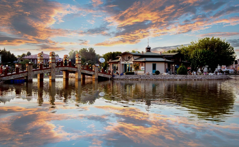 a group of people walking across a bridge over a river, a picture, by Gabor Szikszai, pexels contest winner, shin hanga, dreamy chinese town, sunset + hdri, lake house, colorado