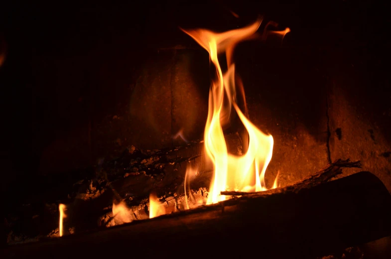a close up of a fire in a fireplace, by Robbie Trevino, fan favorite, instagram photo, stockphoto, background image