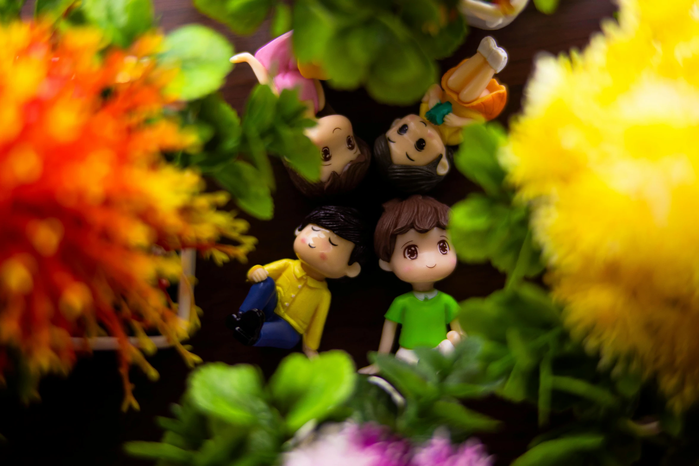 a group of figurines sitting on top of a lush green plant, a cartoon, inspired by Nara Yoshitomo, pexels contest winner, flower frame, shot with sony alpha 1 camera, square enix, colorful picture