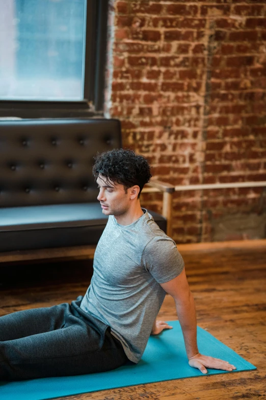 a man is doing an exercise on a yoga mat, by Arabella Rankin, timothee chalamet, profile image