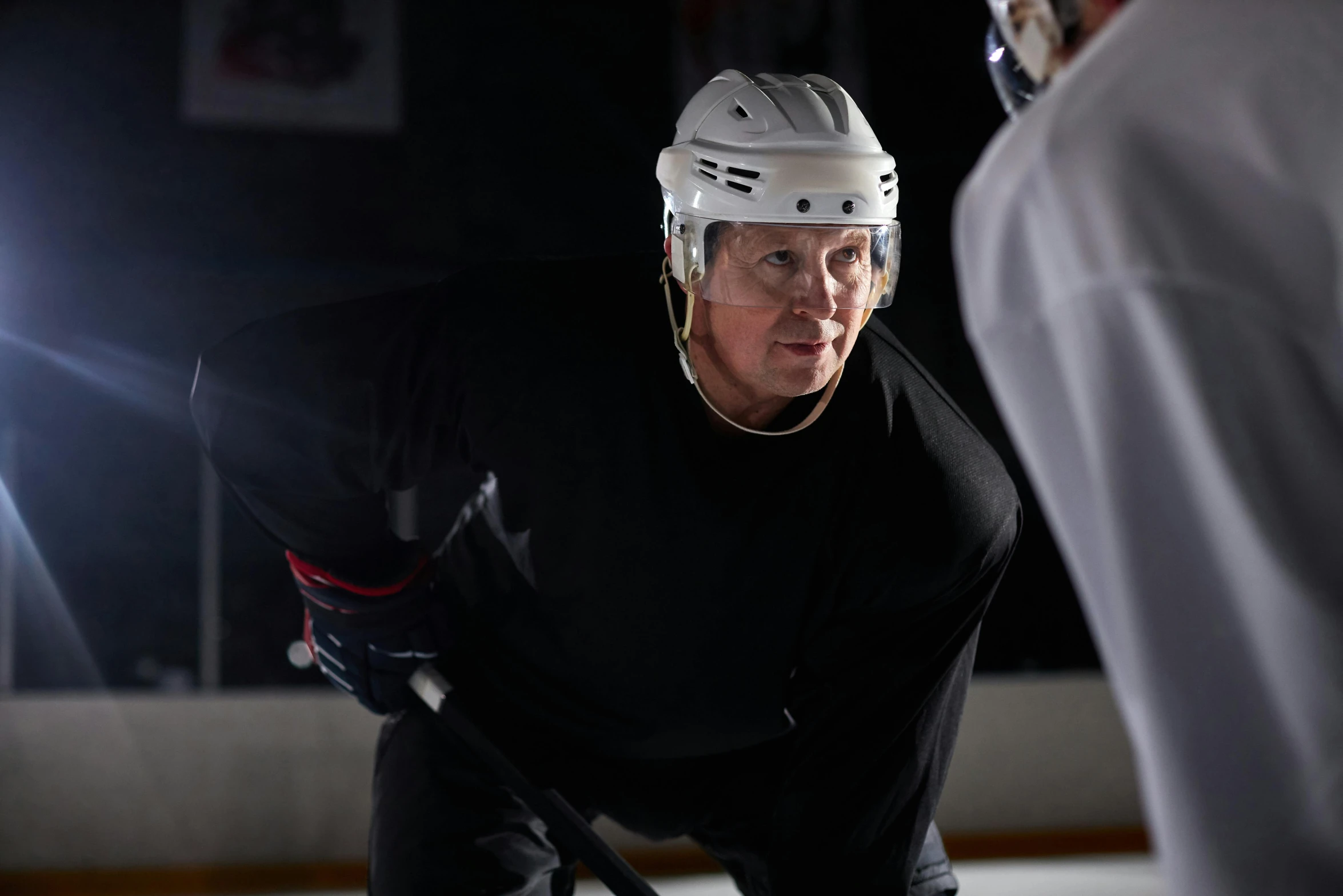 a hockey player getting ready to skate on the ice, a portrait, by Tom Palin, unsplash, photorealism, 7 0 years old, serious lighting, 8 k movie still, no - text no - logo