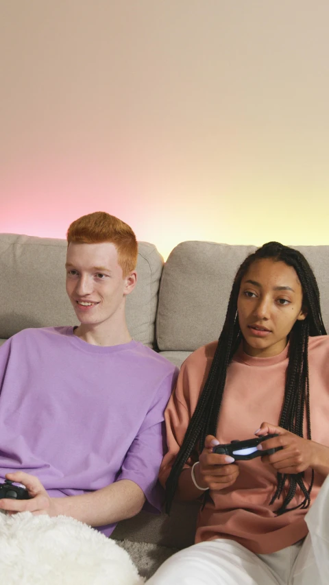 a couple of people that are sitting on a couch, pexels, realism, red haired teen boy, cinematic pastel lighting, mix of ethnicities and genders, promotional image