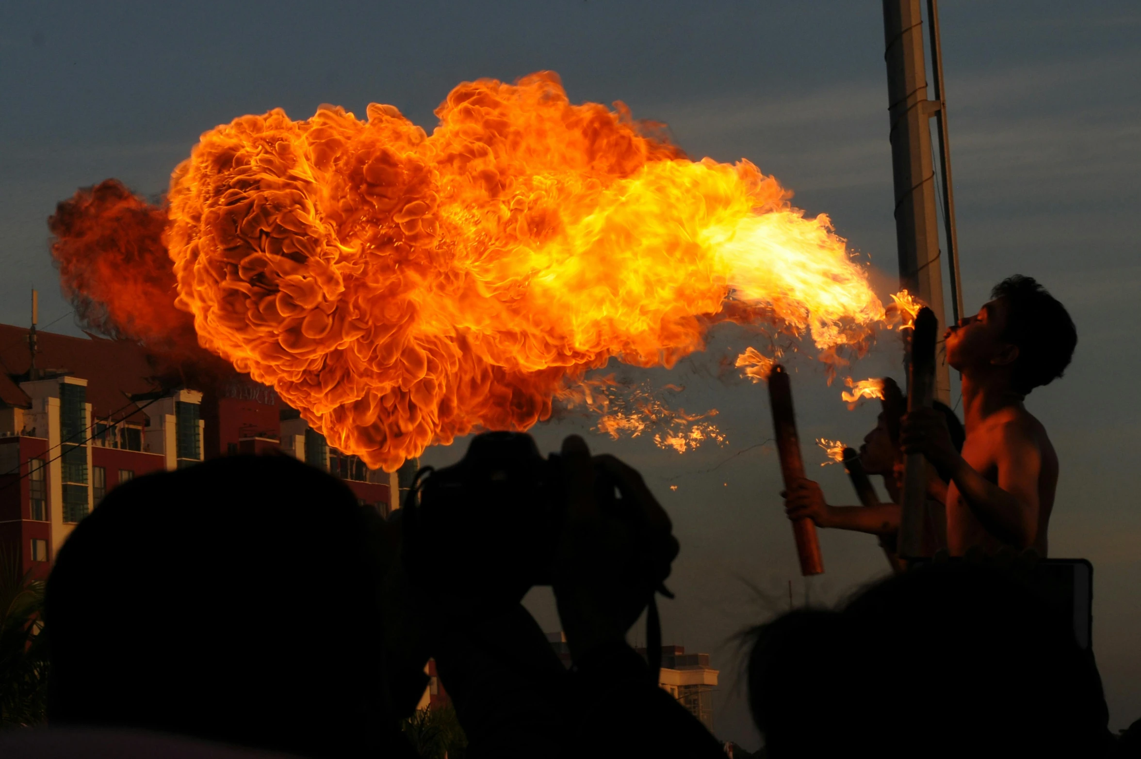 a group of people that are standing in front of a fire, firebreathing, 3 meters, pictured from the shoulders up, bong