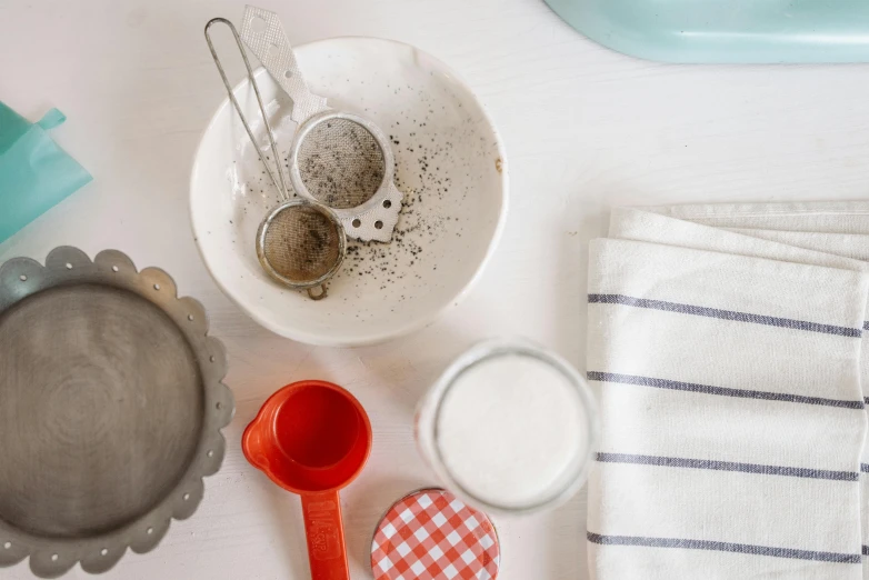 a variety of kitchen utensils sitting on top of a table, by Arabella Rankin, trending on unsplash, plasticien, flour dust, 7 0 mm photo, 15081959 21121991 01012000 4k, detail shot