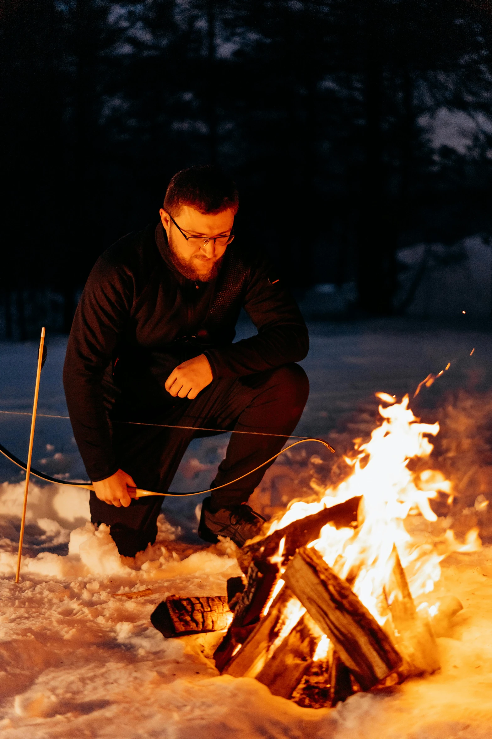a man roasting marshmallows over a campfire, inspired by Einar Hakonarson, land art, winter vibes, profile image, multiple stories, commercial photo