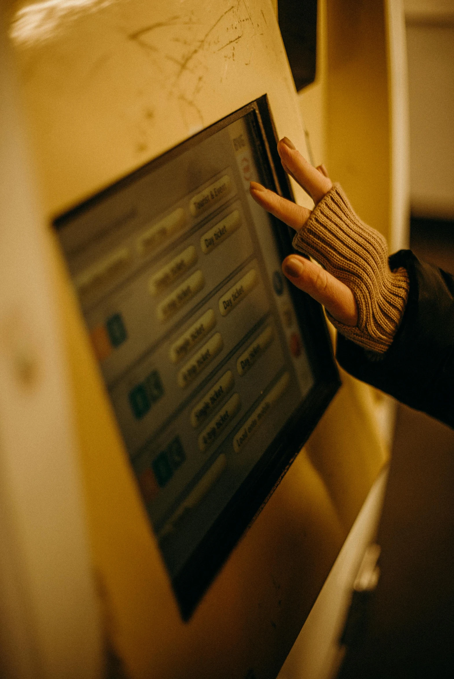 a person touching the screen of a machine, inspired by Elsa Bleda, hot bank, at checkout, wintertime, pointing