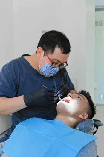 a man getting his teeth examined by a dentist, inspired by Tooth Wu, happening, avatar image, yanjun chengt, profile image, grey