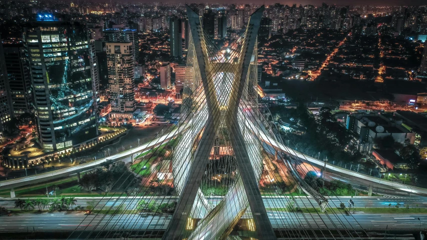 an aerial view of a city at night, by Xavier Blum Pinto, pexels contest winner, santiago calatrava, são paulo, sky bridge, stacked image