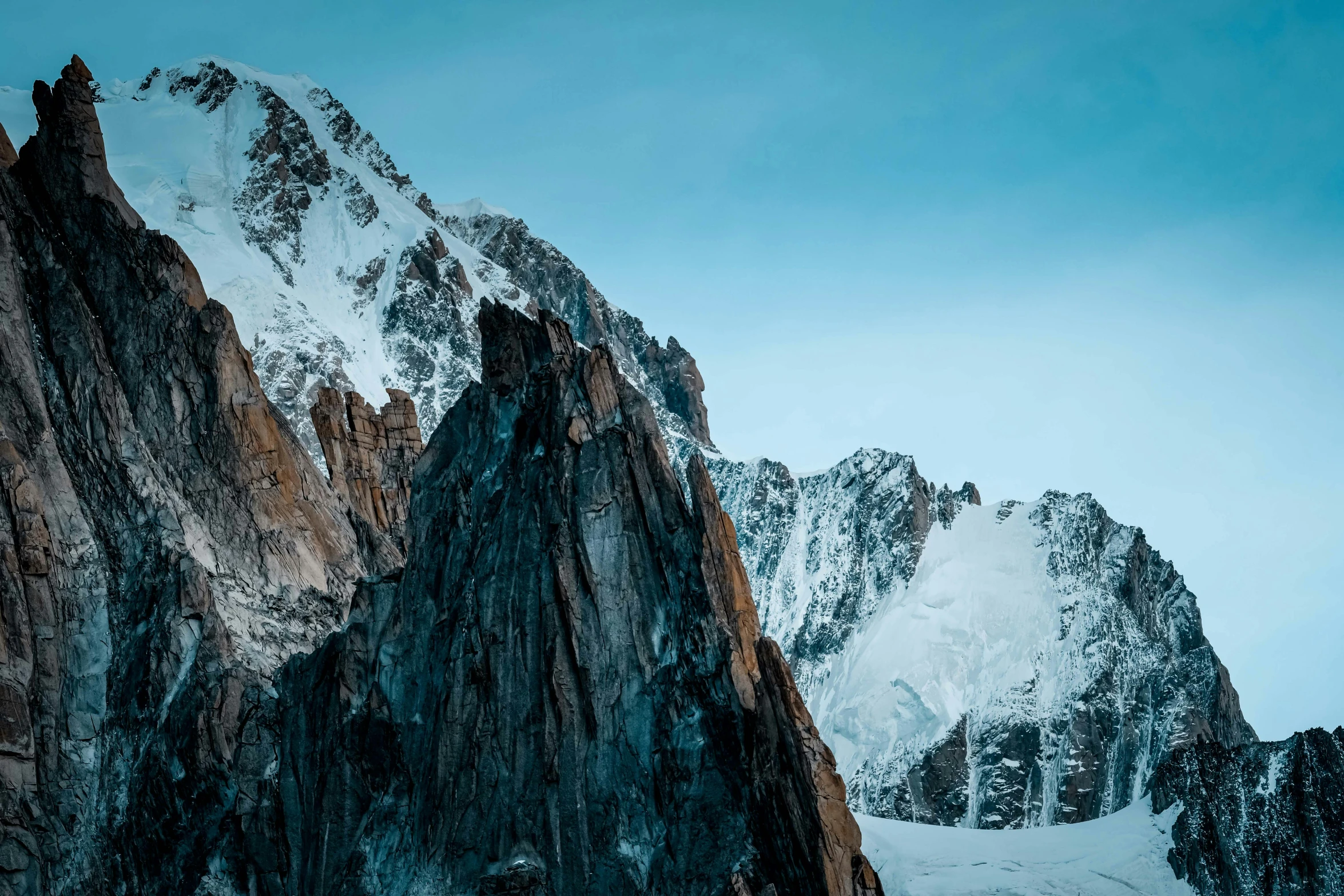 a group of people standing on top of a snow covered mountain, an album cover, pexels contest winner, extremely detailed rocky crag, unsplash 4k, chamonix, wallpaper for monitor