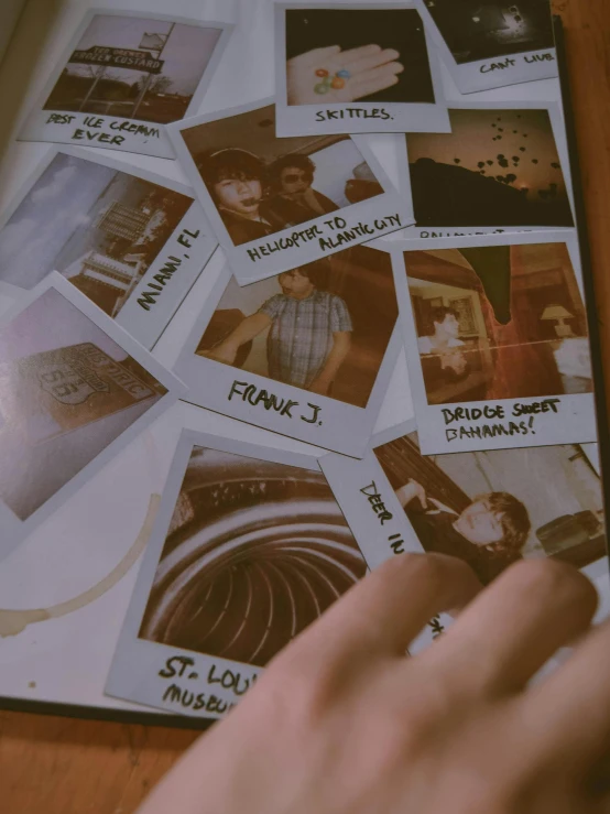 a close up of a person holding a cell phone, a polaroid photo, process art, finn wolfhard, labels, 1 9 7 0 s analog aesthetic, middle of the page