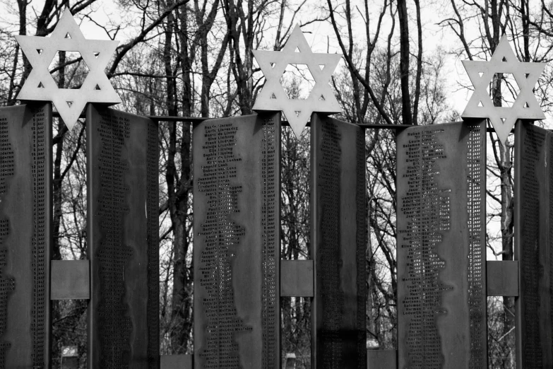 a black and white photo of a memorial, by Kristian Zahrtmann, pexels, hebrew, in a metal forest, panels, warsaw