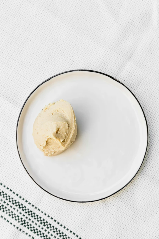 a white plate topped with a scoop of ice cream, unsplash, linen canvas, long shot wide shot full shot, thumbnail, beige