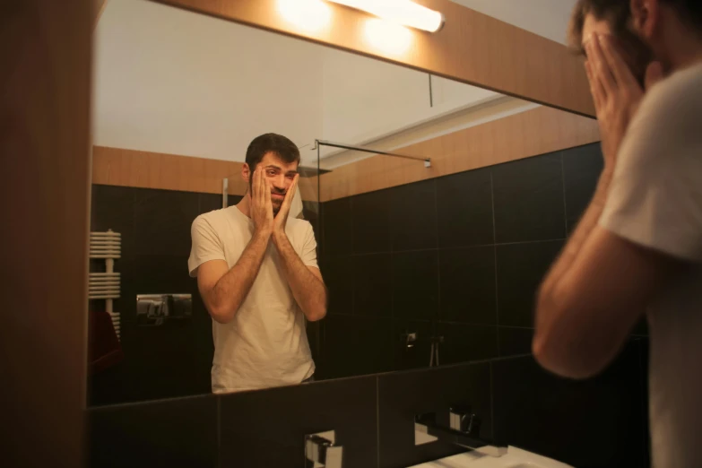 a man shaving his face in front of a mirror, a picture, h3h3, fan favorite, tourist photo, square masculine jaw