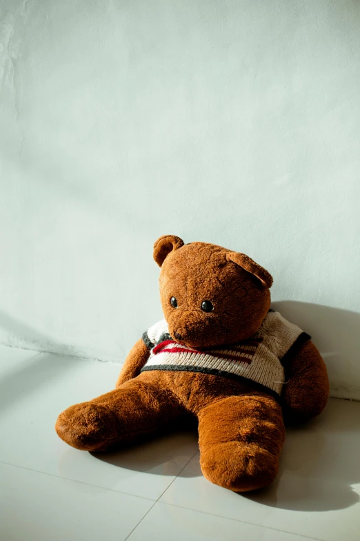 a brown teddy bear sitting on a white surface, slide show, sunlit, carson ellis, taken with sony alpha 9