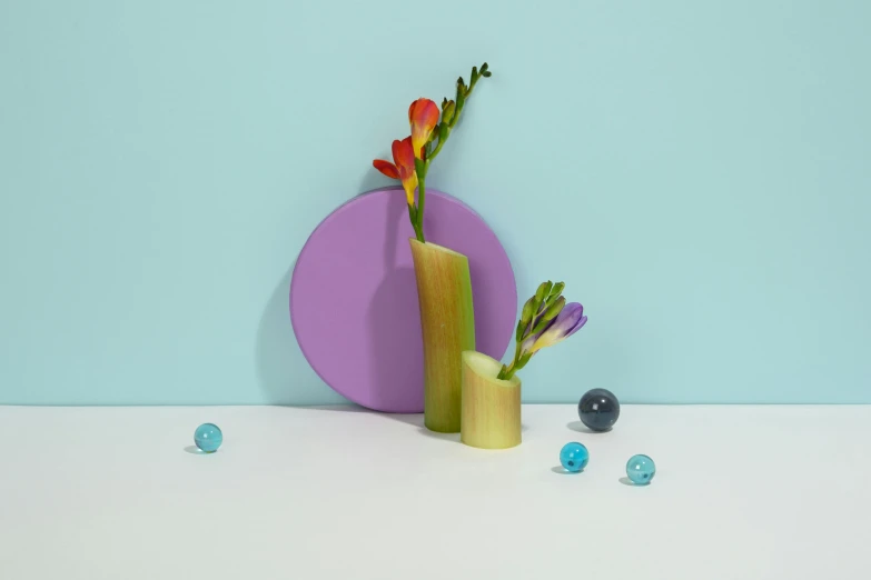 a vase that has some flowers in it, a still life, inspired by Jeff Koons, shutterstock contest winner, green and purple studio lighting, sleek round shapes, with small object details, colourful pastel