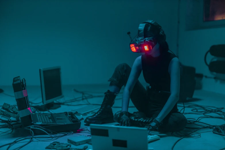 a woman sitting on the floor in front of a laptop, cyberpunk art, inspired by Simon Stålenhag, unsplash contest winner, night vision goggles, solo performance unreal engine, virtual installation, beeple |