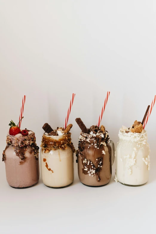 a row of milkshakes sitting next to each other, a still life, unsplash, maple syrup & hot fudge, profile image, 🎀 🧟 🍓 🧚, fully body shot