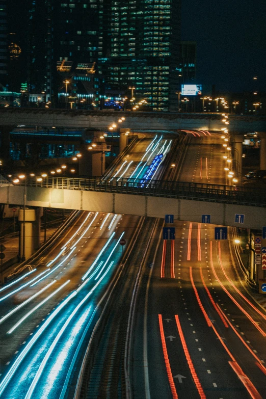 a city street filled with lots of traffic at night, an album cover, by Jacob Toorenvliet, unsplash contest winner, renaissance, overpass, running lights, thumbnail, 2000s photo