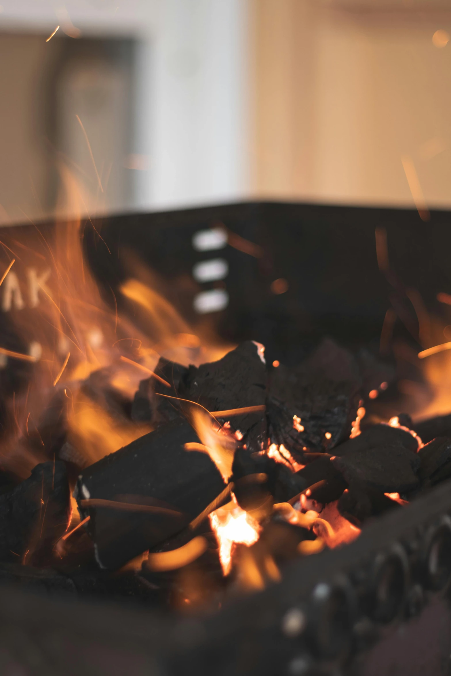 a close up of a fire in a grill, by Daniel Lieske, visual art, slate, cosy atmoshpere, black, premium quality