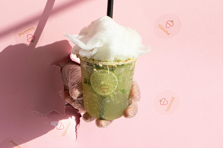 a close up of a person holding a drink, infused with a dream, bangkuart, pastel green, birdseye view