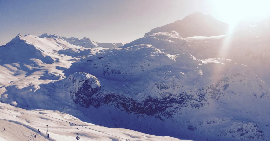 a group of people riding skis down a snow covered slope, an album cover, by Daniel Seghers, pexels contest winner, les nabis, panoramic view, sunfaded, whistler, view from slightly above