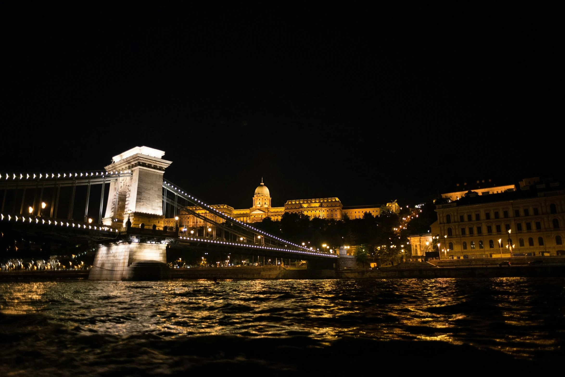 the chain bridge in budapest lit up at night, a photo, pexels contest winner, photo taken from a boat, thumbnail, fujifilm”, instagram picture