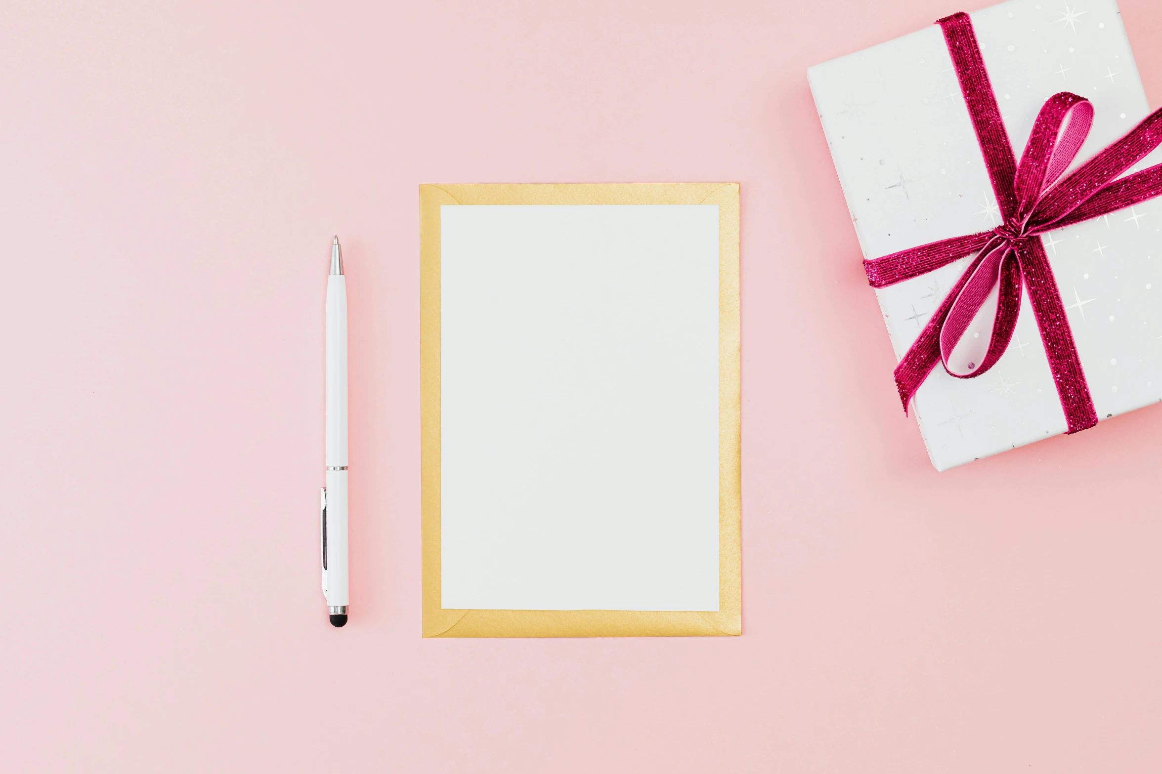 a notepad, pen, and gift on a pink background, by Julia Pishtar, pexels contest winner, wooden frame, card template, white hue, background image