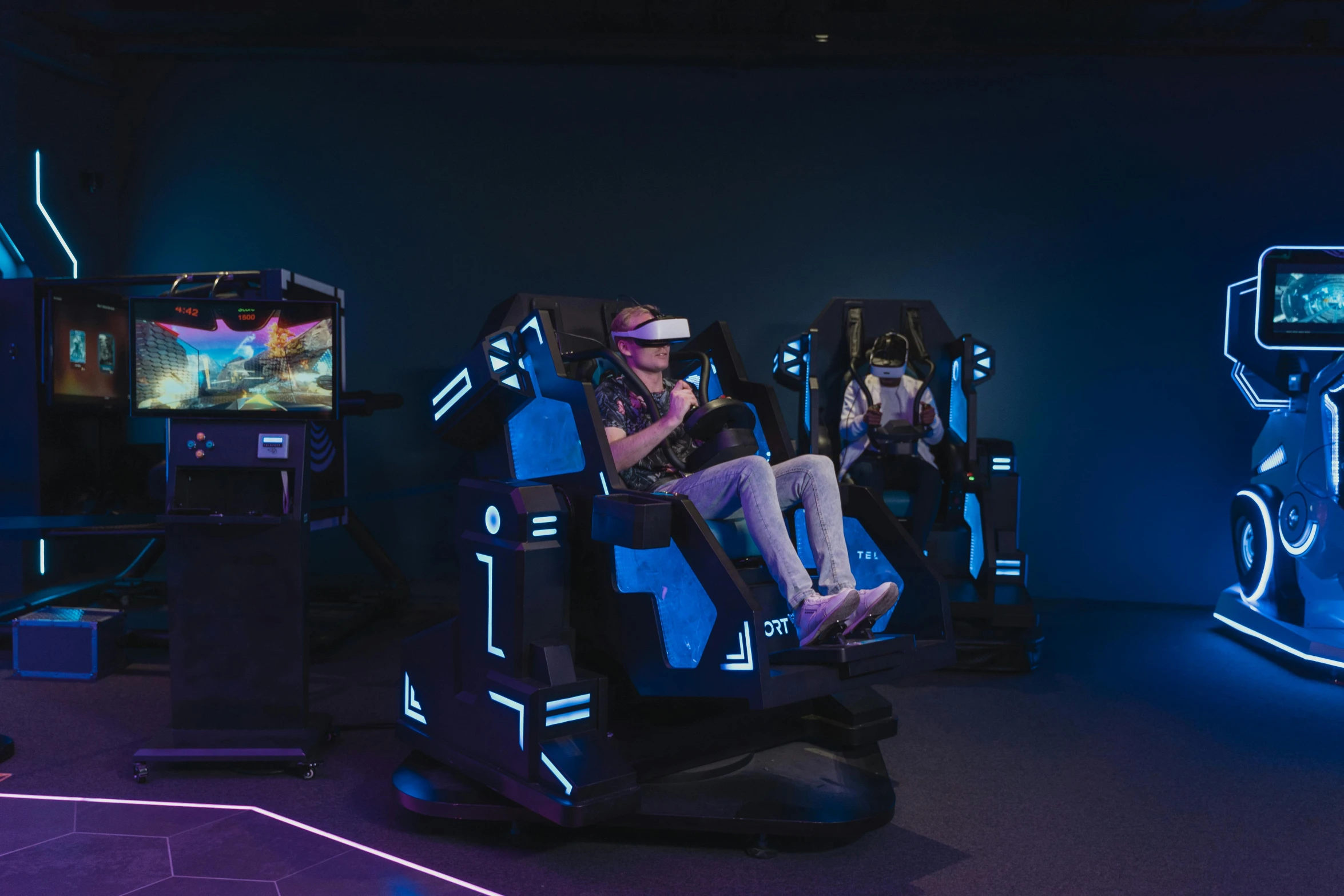 a group of people playing a video game, a hologram, unsplash, alien racing drivers, photograph of 3d ios room, spacestation, sitting