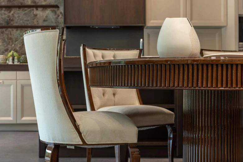 a white vase sitting on top of a wooden table, an art deco sculpture, inspired by Constantin Hansen, chairs and tables, thumbnail, boucheron style, brown