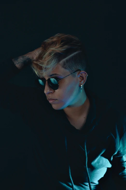 a woman in a black shirt and sunglasses, an album cover, inspired by Nikolaj Abraham Abildgaard, trending on pexels, lesbians, neymar jr, profile pose, multiple lights