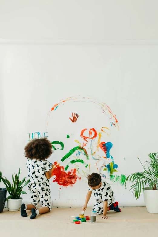 two children painting on a wall in a living room, by Dulah Marie Evans, pexels contest winner, action painting, plants, white bg, colourfull, 144x144 canvas