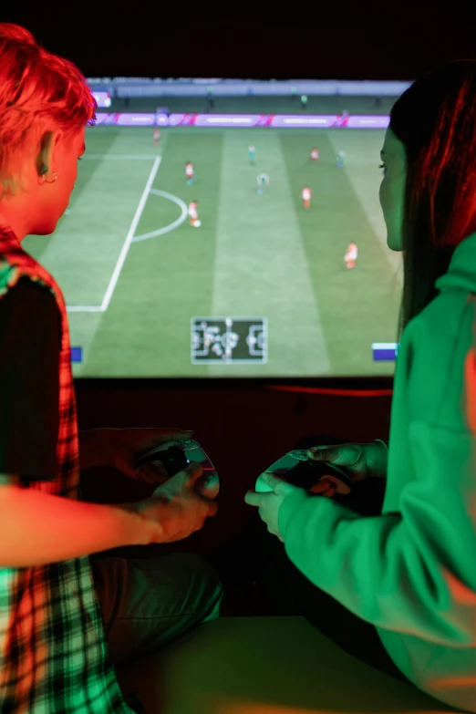 a couple of people that are sitting in front of a tv, interactive art, playing soccer, sierra entertainment games, thumbnail, kids place