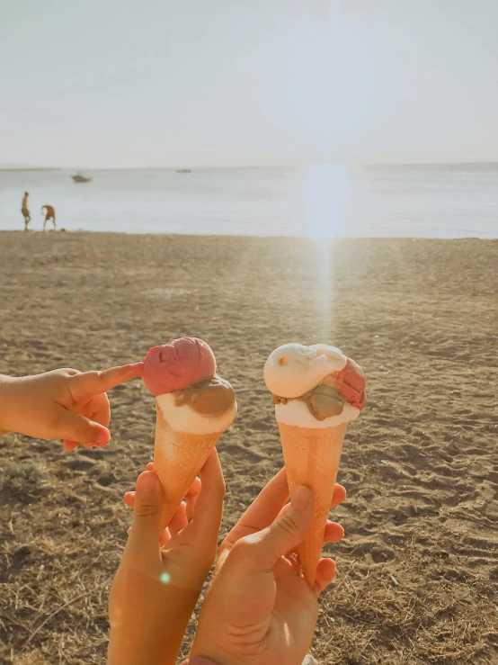 two people holding ice cream cones on a beach, by Julia Pishtar, pexels contest winner, hollister ranch, strawberry ice cream, sun lighting, thumbnail