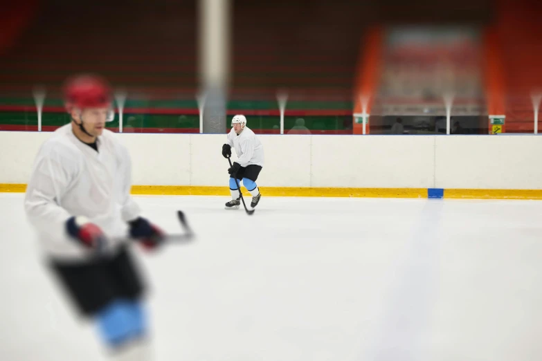 a couple of men playing a game of ice hockey, blurred photo, 15081959 21121991 01012000 4k, extreme panoramic, instagram photo