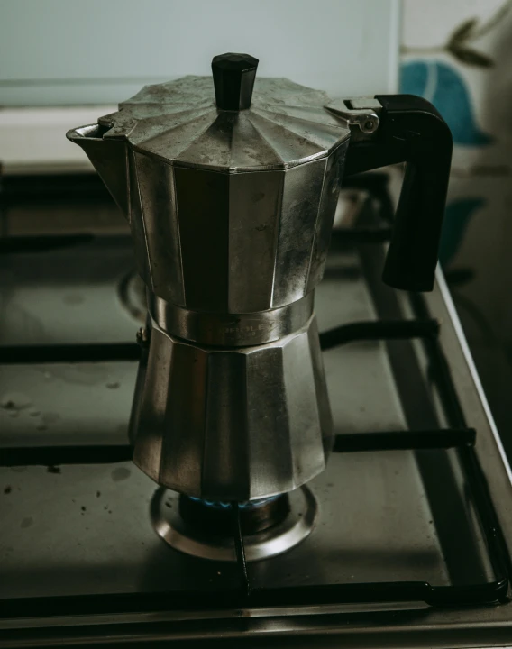 a stove top with a coffee pot on top of it, pexels contest winner, grey alien, thumbnail, colombian, multiple stories