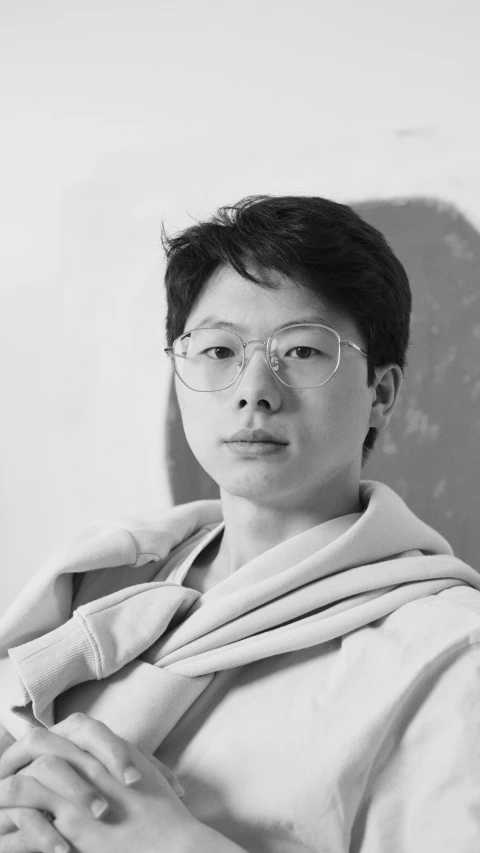 a black and white photo of a woman wearing glasses, inspired by Fei Danxu, sun-hyuk kim, androgynous person, nft portrait, young wan angel