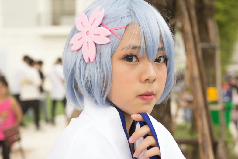 a woman with blue hair and a pink flower in her hair, inspired by Leng Mei, featured on reddit, seifuku, close up portrait photo, 2022 anime style, cirno