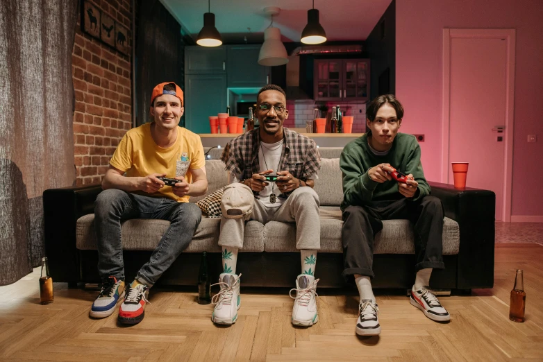 three men sitting on a couch playing video games, inspired by NEVERCREW, pexels contest winner, antipodeans, wearing nike air mags, portrait 8 k, wiz khalifa, promotional image