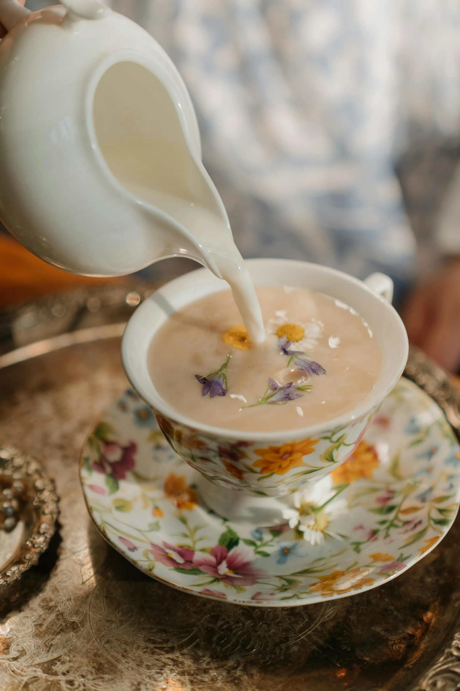 a person pouring milk into a cup on a saucer, floral dream, thumbnail, alabama, creamy skin