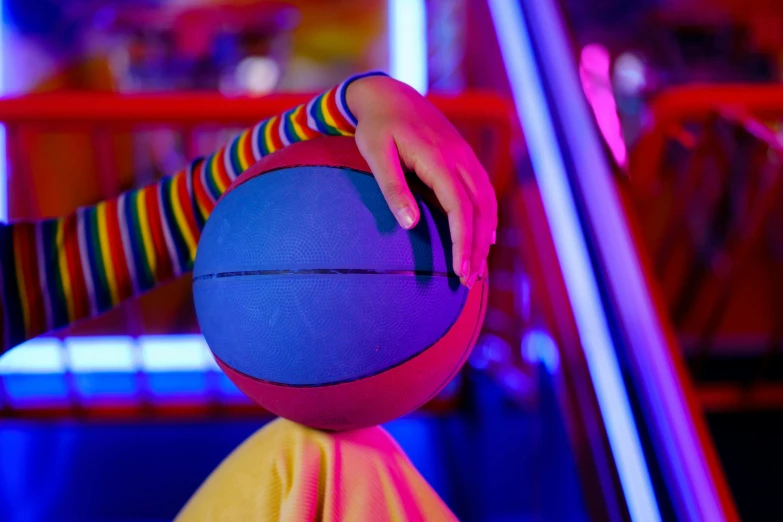 a close up of a person holding a basketball, interactive art, pink yellow and blue neon signs, amusement park interior design, kids place, multi - coloured