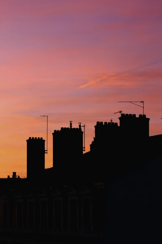 a very tall clock tower towering over a city, an album cover, by Ian Fairweather, pexels contest winner, renaissance, chimneys, silhouette :7, dover castle, during dawn