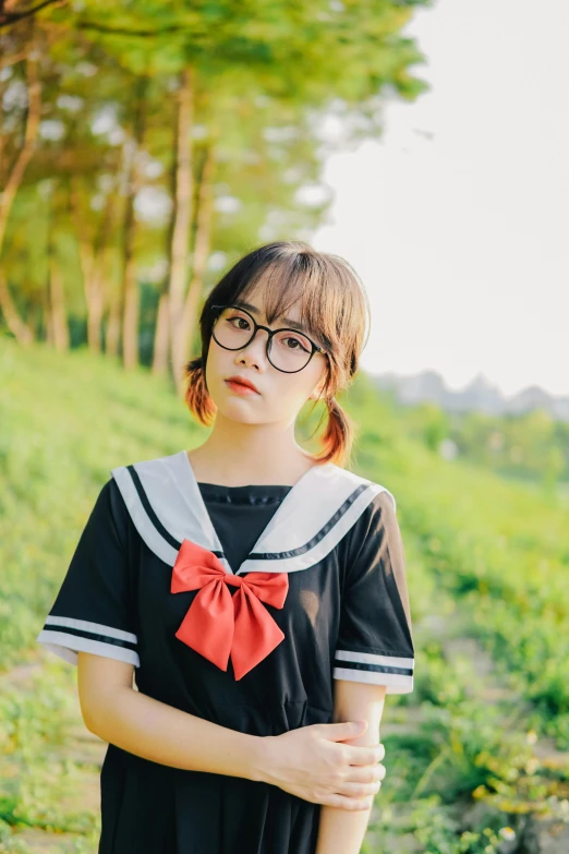 a woman in a black dress with a red bow, inspired by Rumiko Takahashi, unsplash, square rimmed glasses, sailor uniform, male ulzzang, 🚿🗝📝