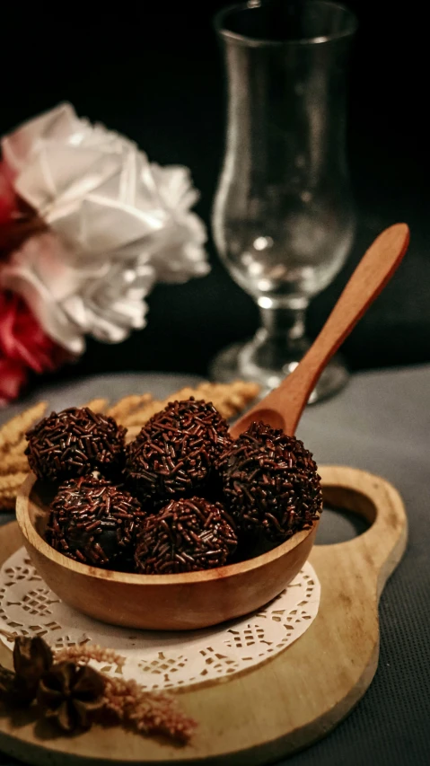a wooden bowl filled with nuts on top of a table, by Basuki Abdullah, pexels, candy decorations, award winning dark, luscious patty with sesame seeds, brown:-2
