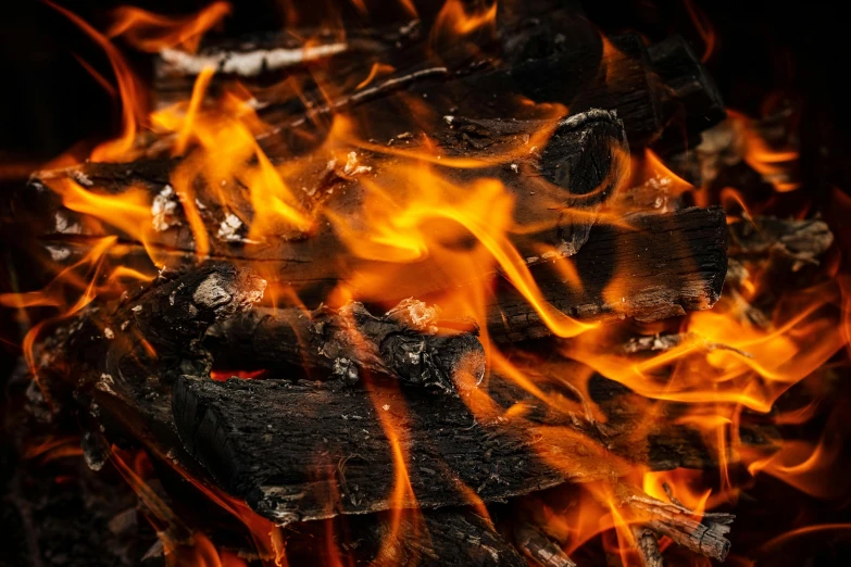 a pile of wood sitting on top of a fire, pexels contest winner, skin of flames, background image, avatar image