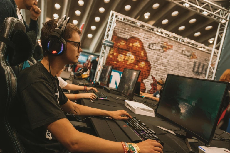 a group of people playing a video game, by Adam Marczyński, tournament, girl wearing headphones, profile image, pc screen image