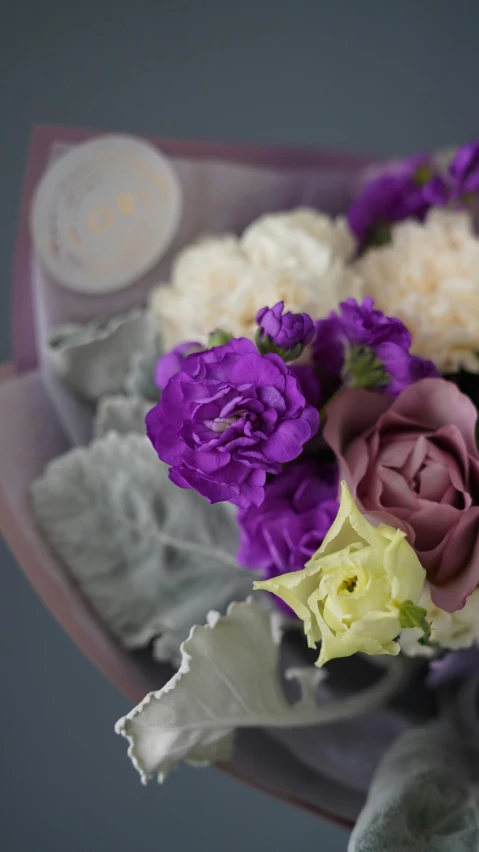 a close up of a bouquet of flowers, purple mist, detailed product shot, wax, no cropping