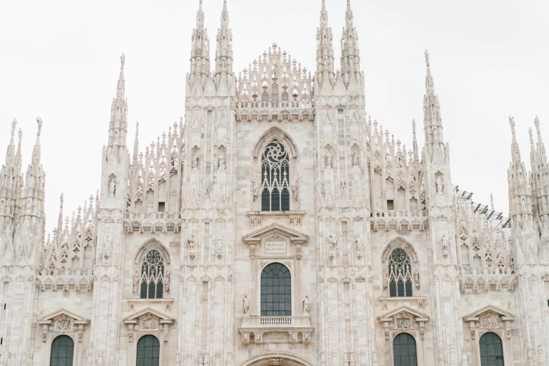 a group of people standing in front of a cathedral, inspired by Michelangelo Buonarotti, pexels contest winner, neoclassicism, white pale concrete city, milan schere, tall metal towers, youtube thumbnail