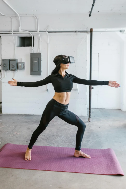 a woman doing a yoga pose on a yoga mat, a hologram, unsplash, interactive art, wearing a vr headset, “ full body, standing athletic pose, cardboard