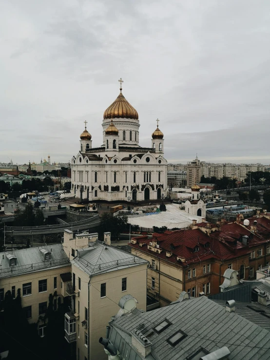 a large building with a golden dome on top of it, by Julia Pishtar, pexels contest winner, socialist realism, skyline view from a rooftop, 000 — википедия, white church background, high view