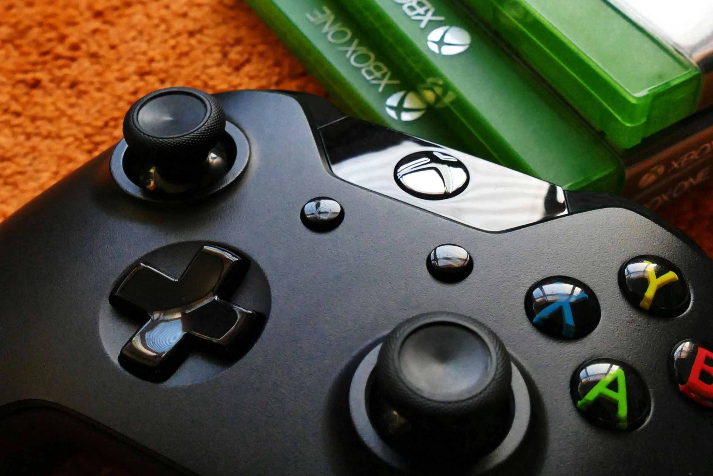 a close up of a video game controller, pexels, renaissance, lush green, an the first xbox, an olive skinned, schools